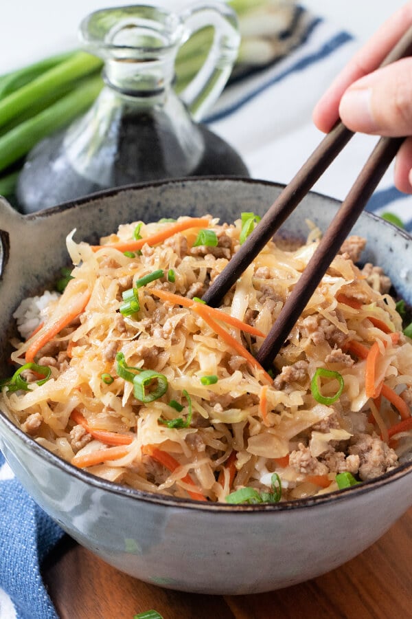 using chopsticks to pick up food