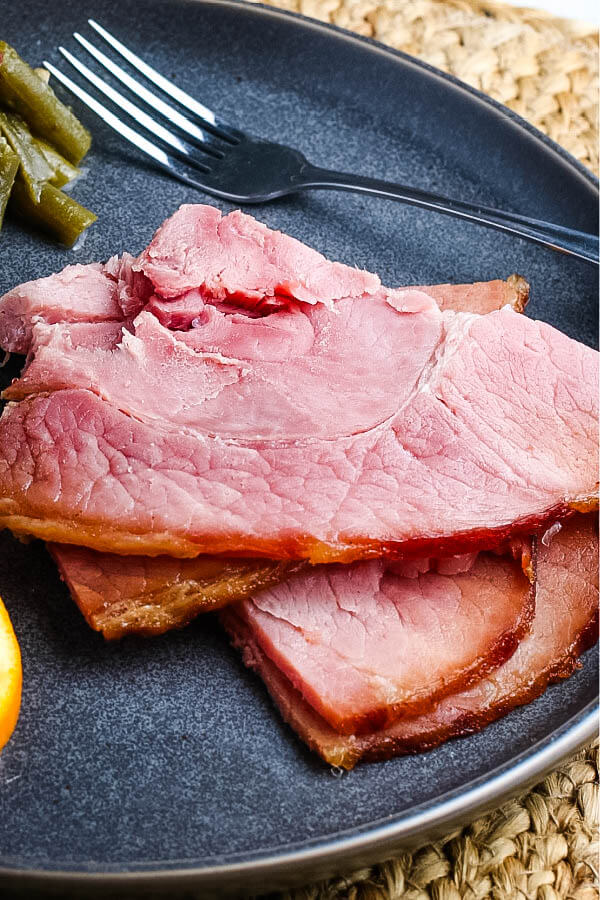 ham slices on plate with fork