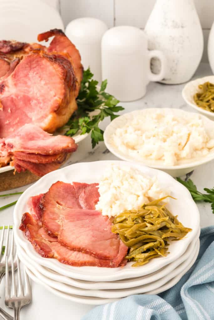 ham on plate with side dishes