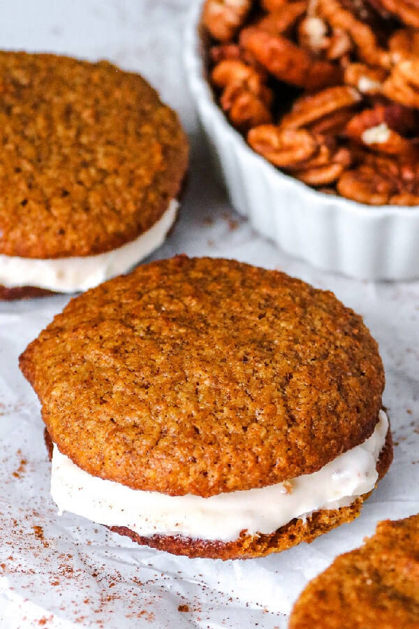 finished cookies with a bowl of pecans