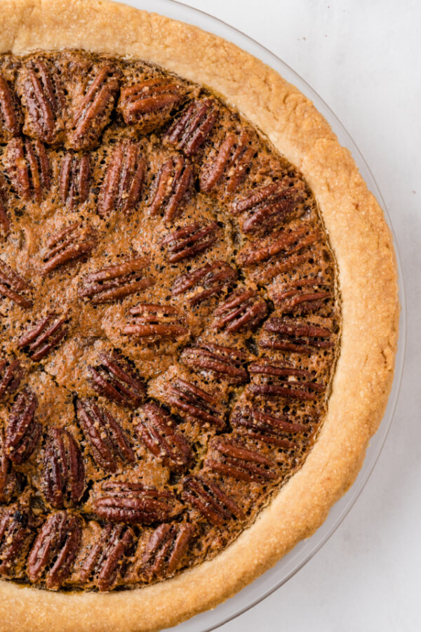 finished baked pecan pie with maple syrup