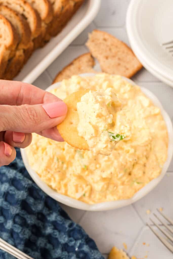 a cracker with egg salad