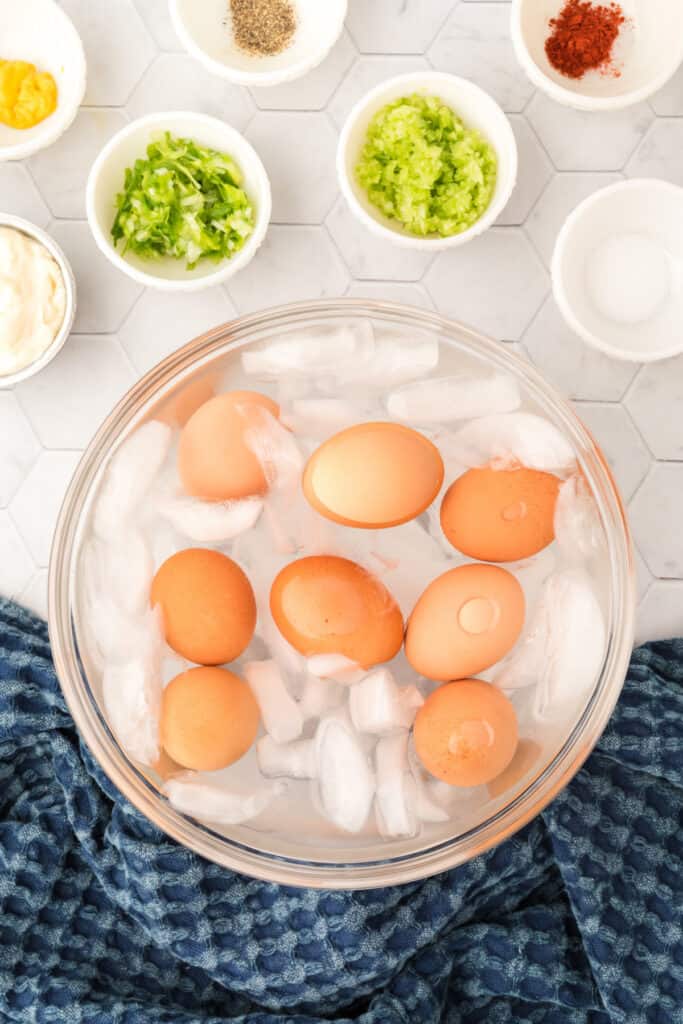 Remove the eggs to a large bowl with ice water and let the eggs cool.