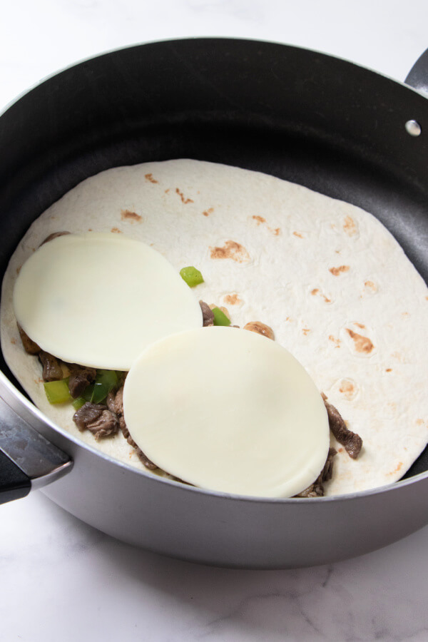 cooking the quesadilla in the pan