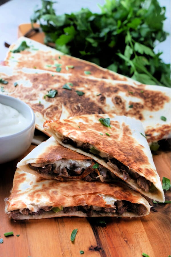 philly cheesesteak wedges stacked on top of each other