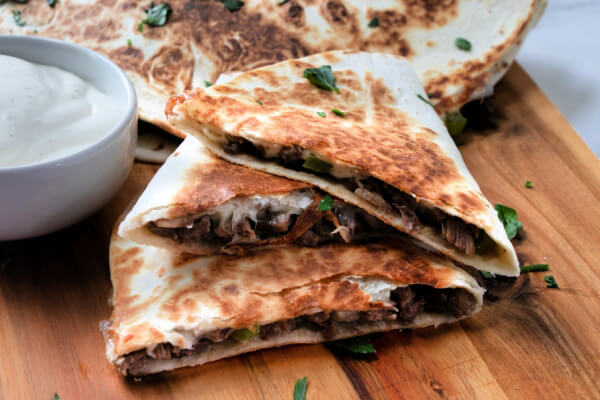 3 wedges of quesadilla stacked