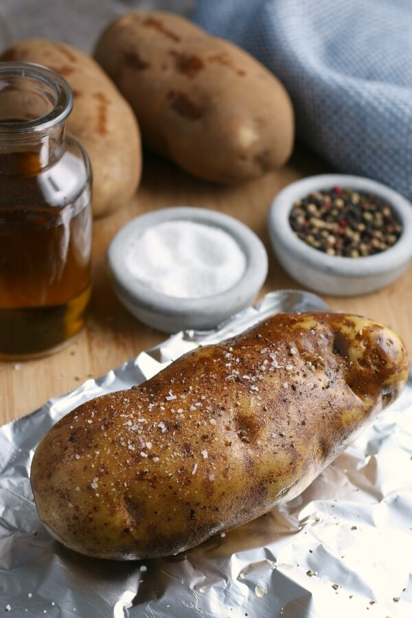 potato seasoned with salt and pepper before being wrapped in foil