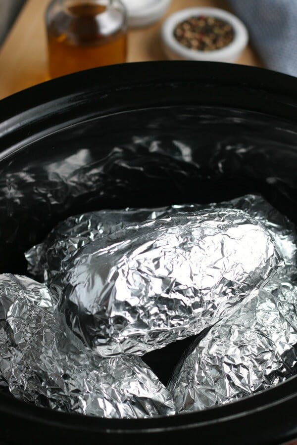 foil wrapped potatoes in slow cooker crock