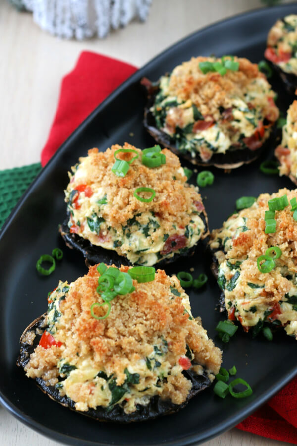 stuffed mushrooms on black plate