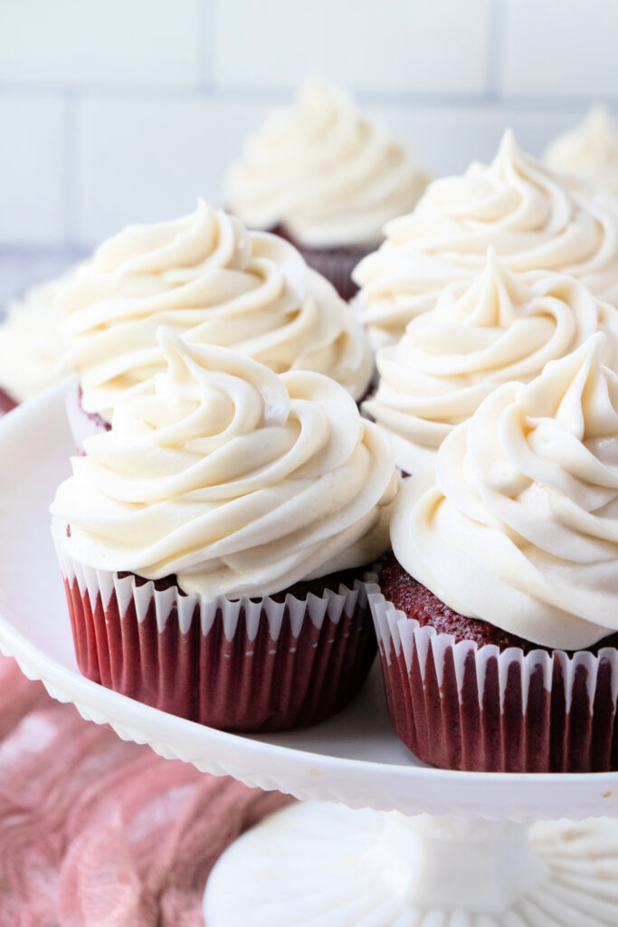 frosted cupcakes on cake stand