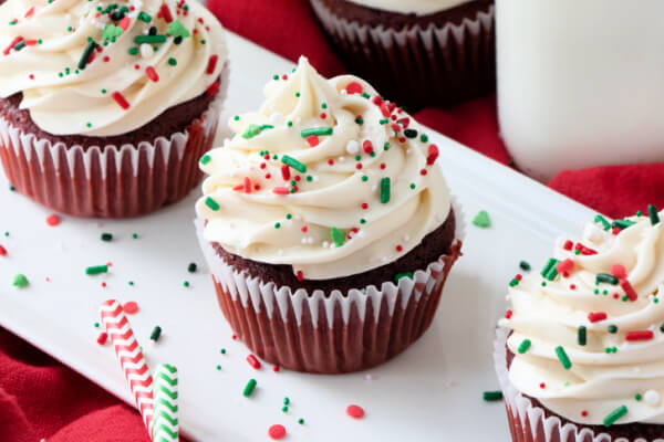 cupcakes on white plate with sprinkles