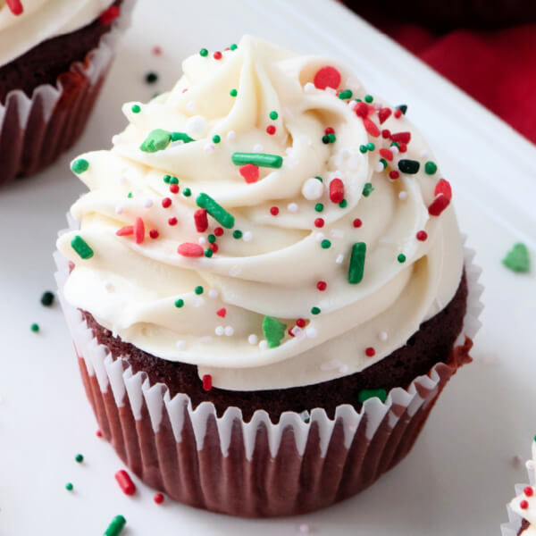 closeup of finished frosting on cupcake with sprinkles