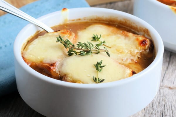 bowl of french onion soup with a spoon in it