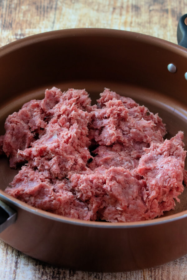 raw ground beef in pan ready to cook
