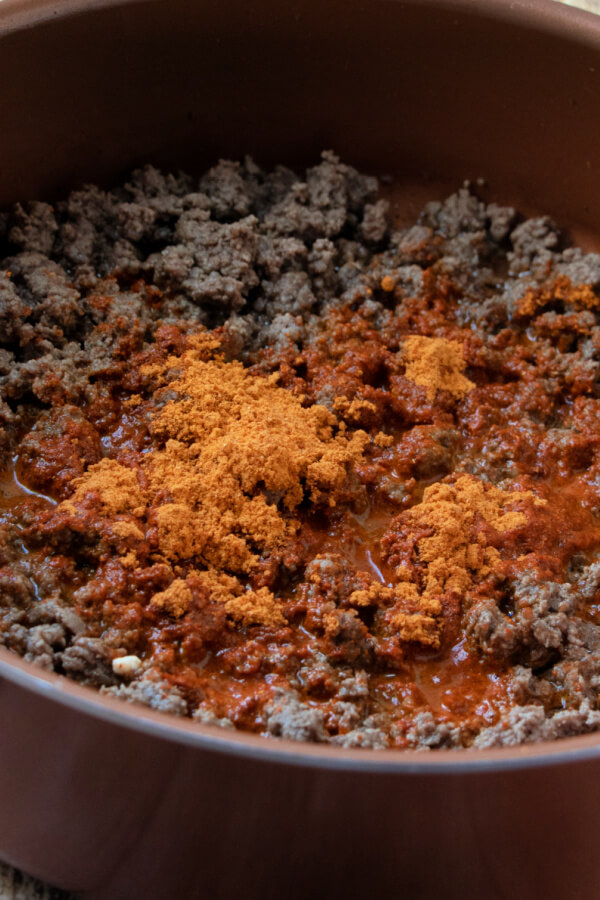 taco seasoning added to the cooked ground beef