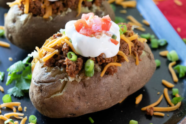 potato taco on black plate