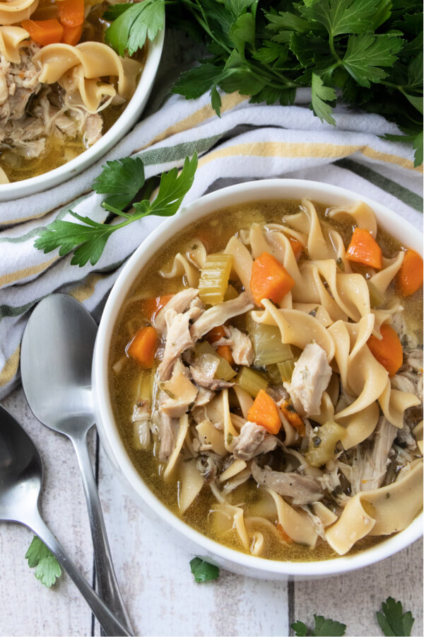 bowls of soup with spoons on side