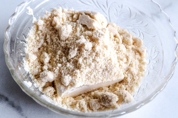 cream cheese, swerve sugar, and almond flour in bowl