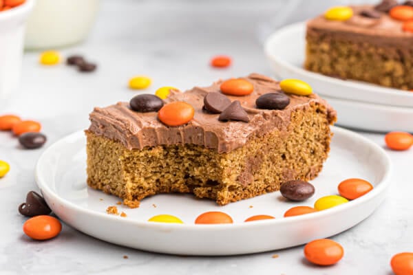 peanut butter cookie bars on white plate with candies