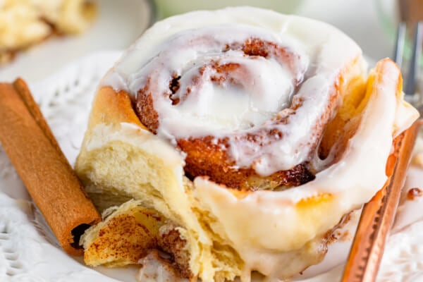 cinnamon roll with cream cheese icing on plate