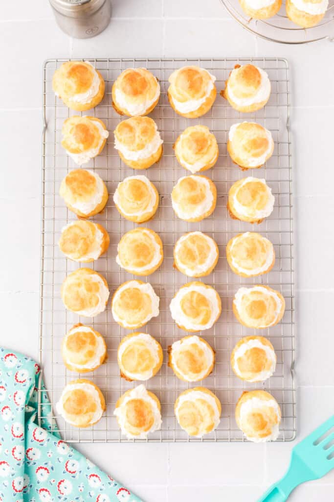 Dust the cream puffs with additional powdered sugar for garnish, if desired.
Serve immediately.