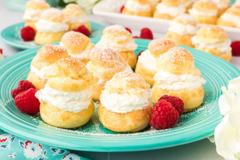 cream puffs on teal plate