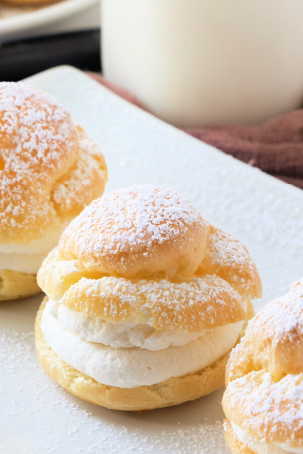 delicious cream puff with vanilla filling on whit eplate