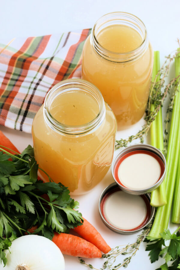 looking down into two jars of homemade stock