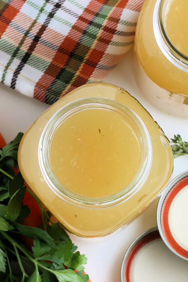 looking down into a jar of homemade turkey stock