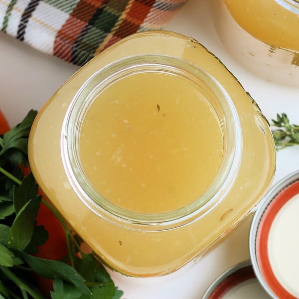 closeup of turkey stock in glass canning jar