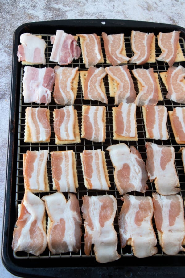 bacon pieces on top of the crackers
