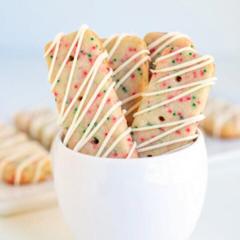 closeup christmas shortbread cookies in white bowl