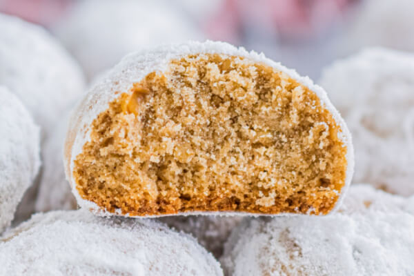 Gingerbread Pecan Snowball cookie cut in half