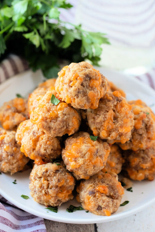 baked sausage balls stacked on plate ready to serve