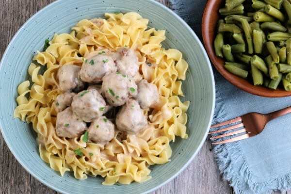 Swedish Meatballs over noodles with a side of green beans