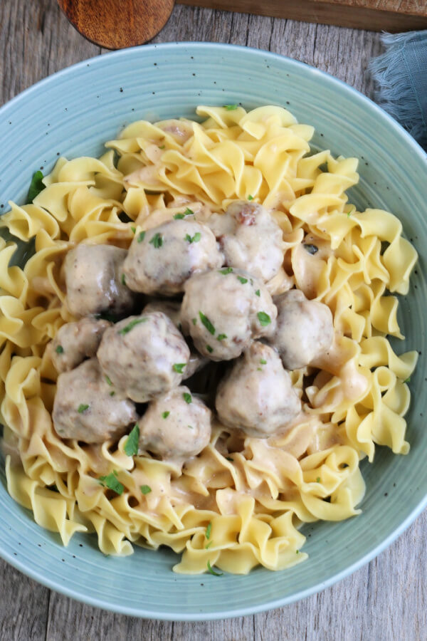 looking down onto a finished bowl of Swedish Meatballs in Gravy with wide egg noddles