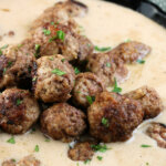 closeup of Swedish meatballs in gravy