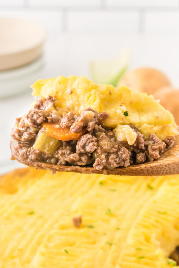 scoop of shepherds pie on wooden serving spoon