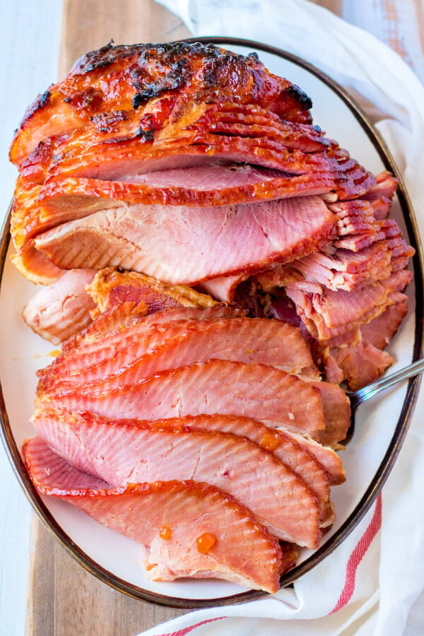 looking down onto a platter with apricot dijon spiral ham