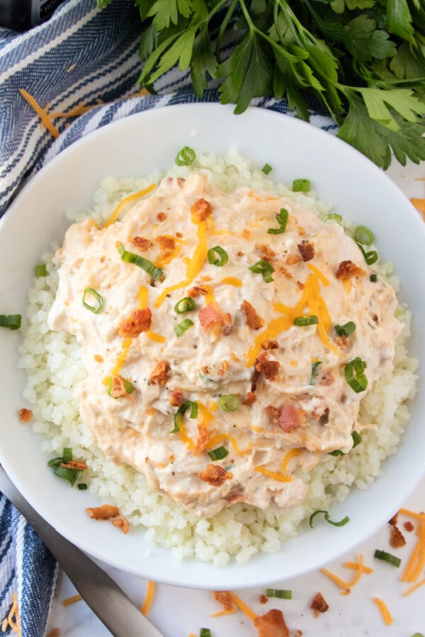 overhead looking down onto a bowl of crack chicken over cauliflower rice