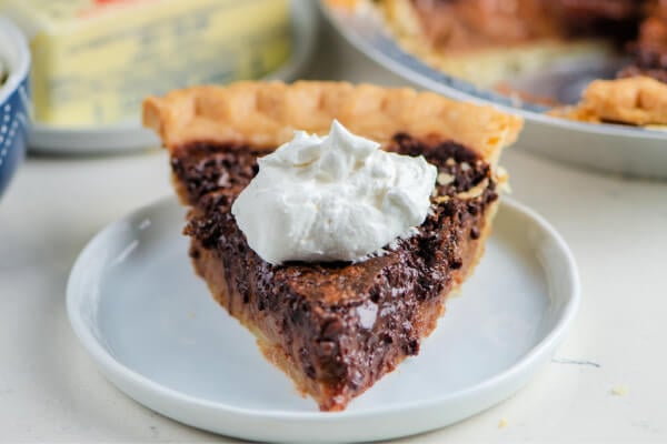 slice of chocolate chess pie on white plate