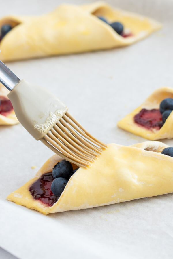 how to fold danish pastry - fold opposite edge over and brush with egg wash