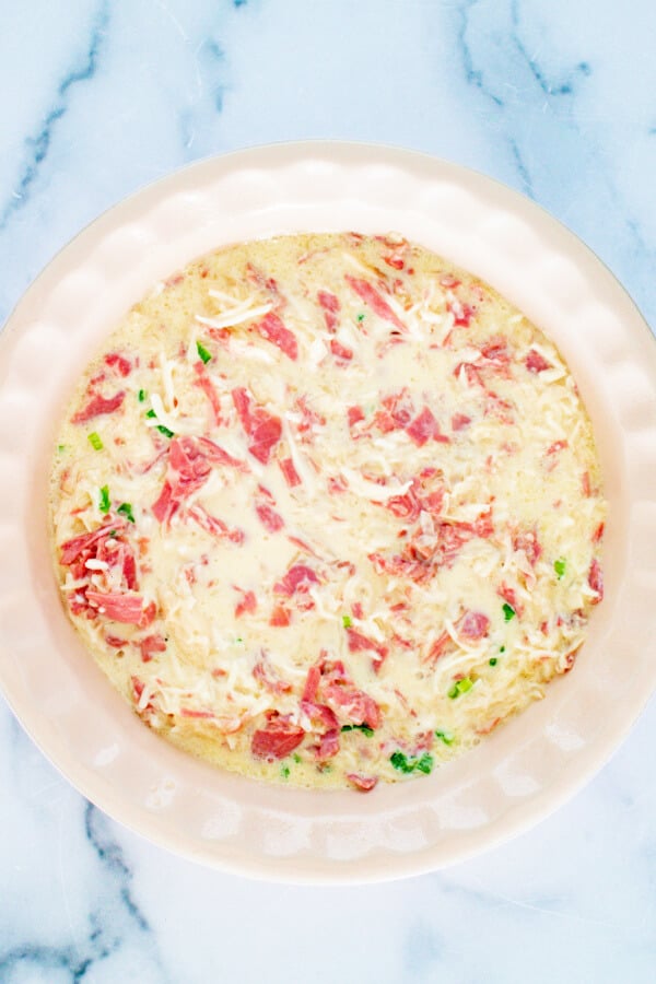 the combined egg mixture in a pie plate ready to bake