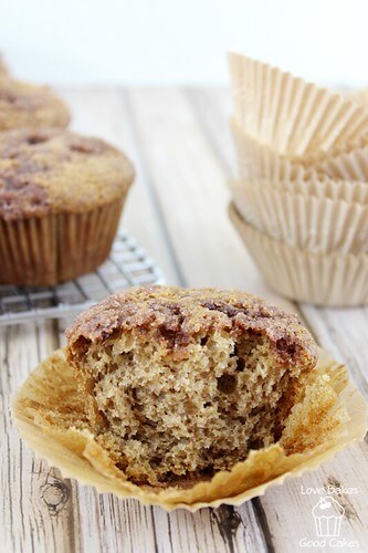 Cinnamon Applesauce Crunch Muffins close up with a bite eaten out of the center.