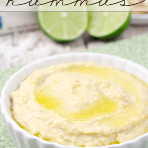 Tropical Hummus in a white bowl with a lime.
