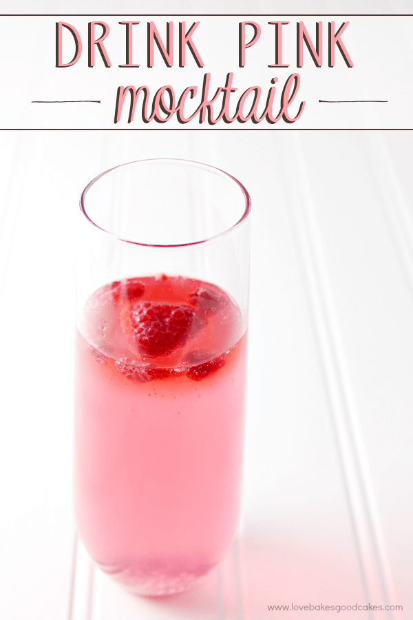 Drink Pink Mocktail in a glass with fresh strawberries.