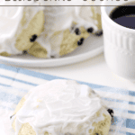 Iced Blueberry Scones on a white plate.