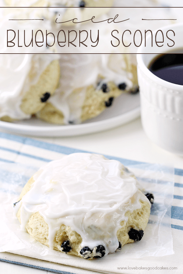 Iced Blueberry Scones on a white plate.