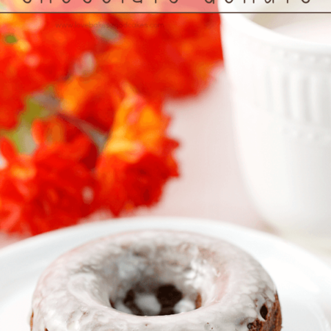 Glazed Chocolate Donuts on a white plate.