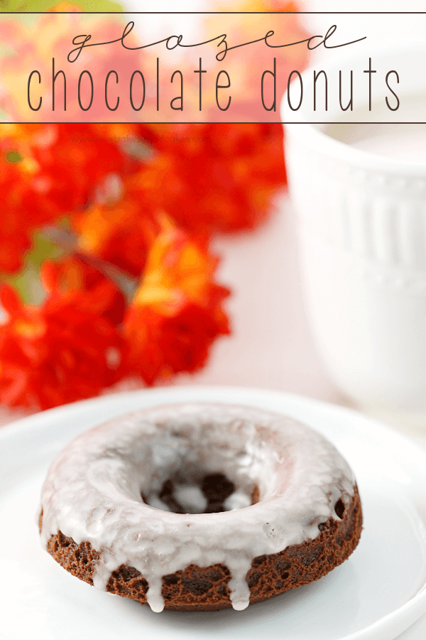 Glazed Chocolate Donuts on a white plate.